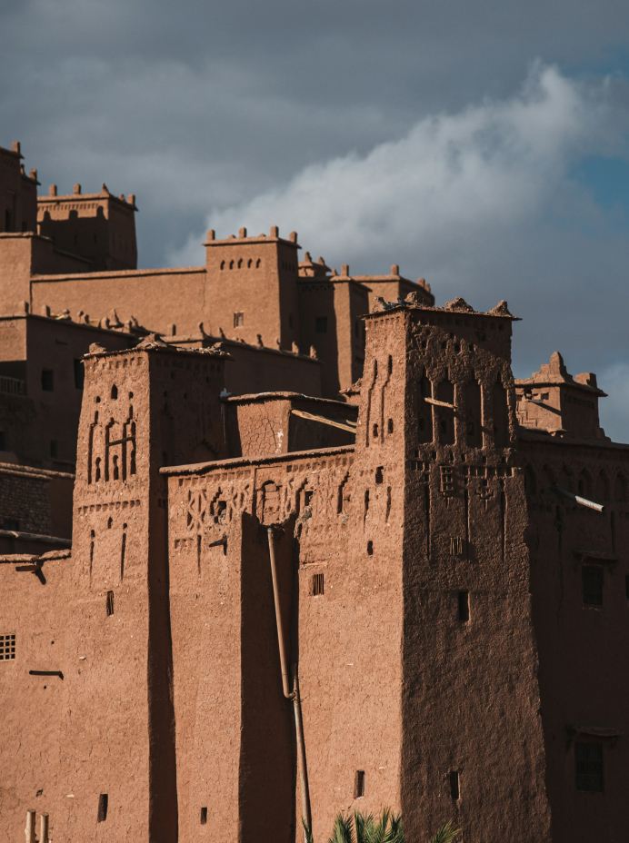 Kasbah above green fields