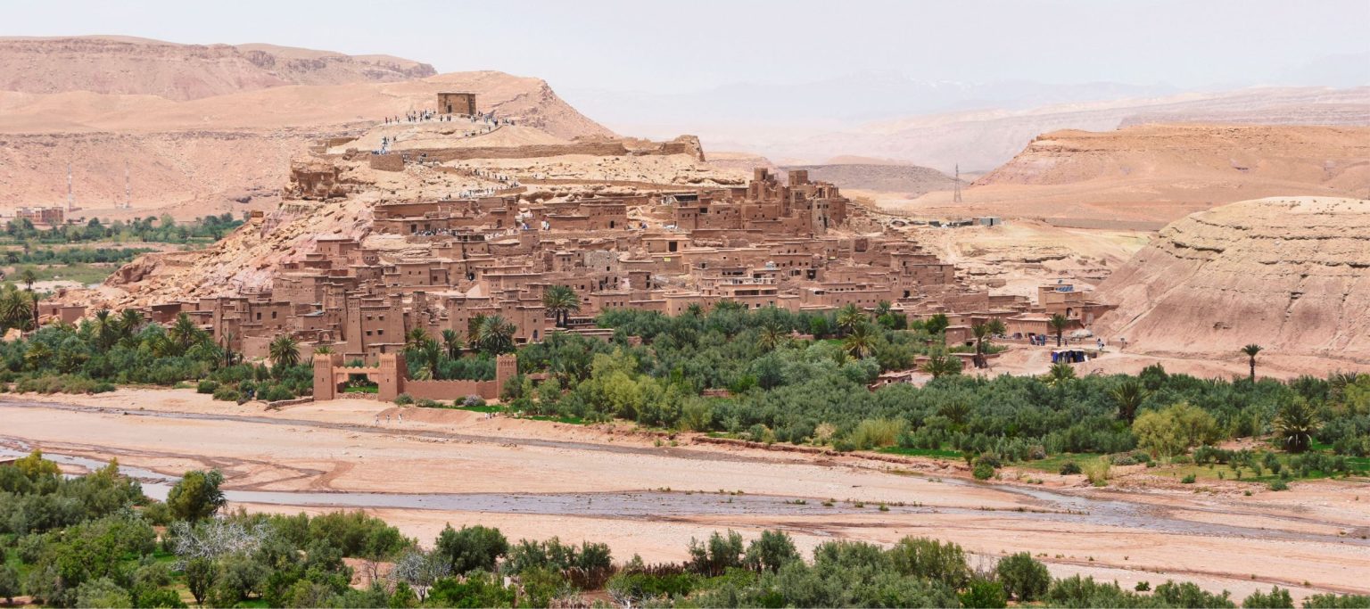 The ksar of Aït Ben Haddou on its hill, seen across the riverbed and palms