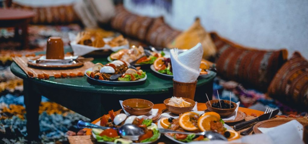 A low table laid with many small dishes and bread